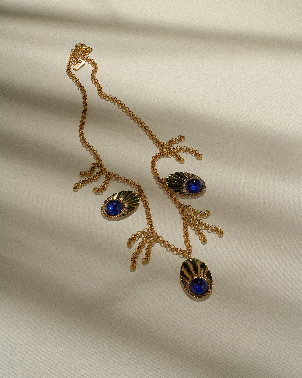 CROWN SHELL NECKLACE WITH BLUE ZIRCONS